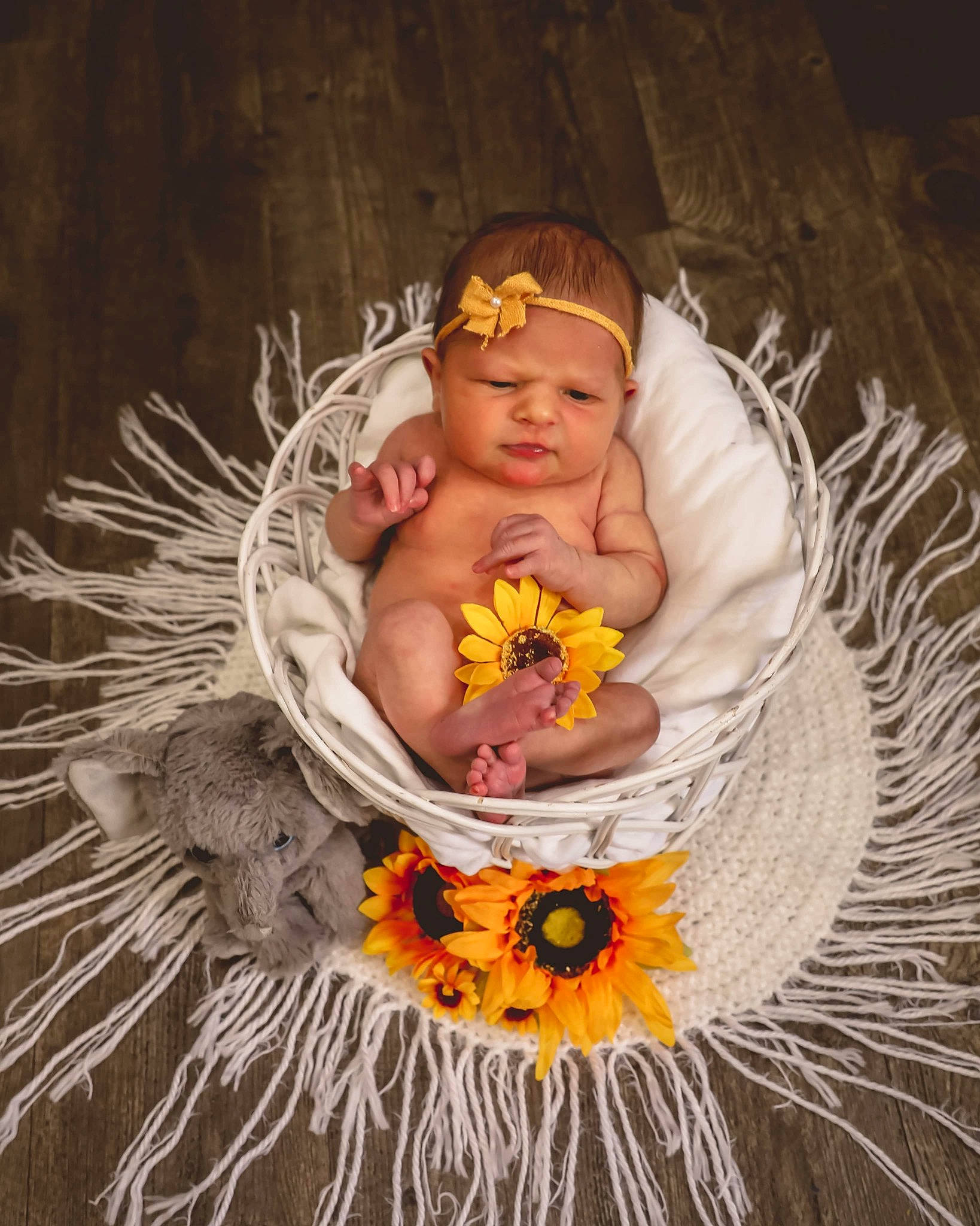 Lakelyn joined the competition — help win amazing prizes! baby, baby_toddler_clothing, chair, child, costume, costume_hat, cut_flowers, event, eye, fashion_accessory, fur, happy, head, headgear, headpiece, headwear, jewellery, lei, necklace, person