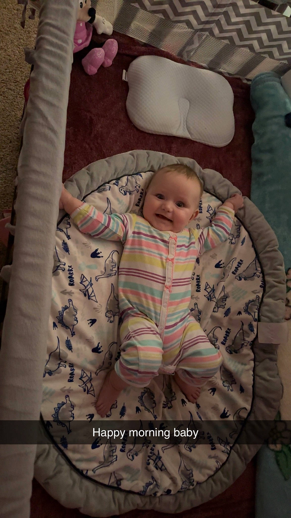 Brooklyn is registered to the contest to win money with this photo: baby, baby_products, baby_safety, baby_sleeping, baby_toddler_clothing, cheek, child, comfort, flooring, head, joy, linens, pattern, person, pink, product, room, sitting, sleeve, smile