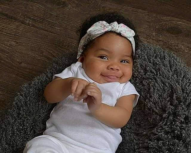 Alivia is registered to the contest to win money with this photo: bonnet, cap, child, fashion_accessory, girl, hair_accessory, headband, headgear, headpiece, infant, joy, person, smile, toddler