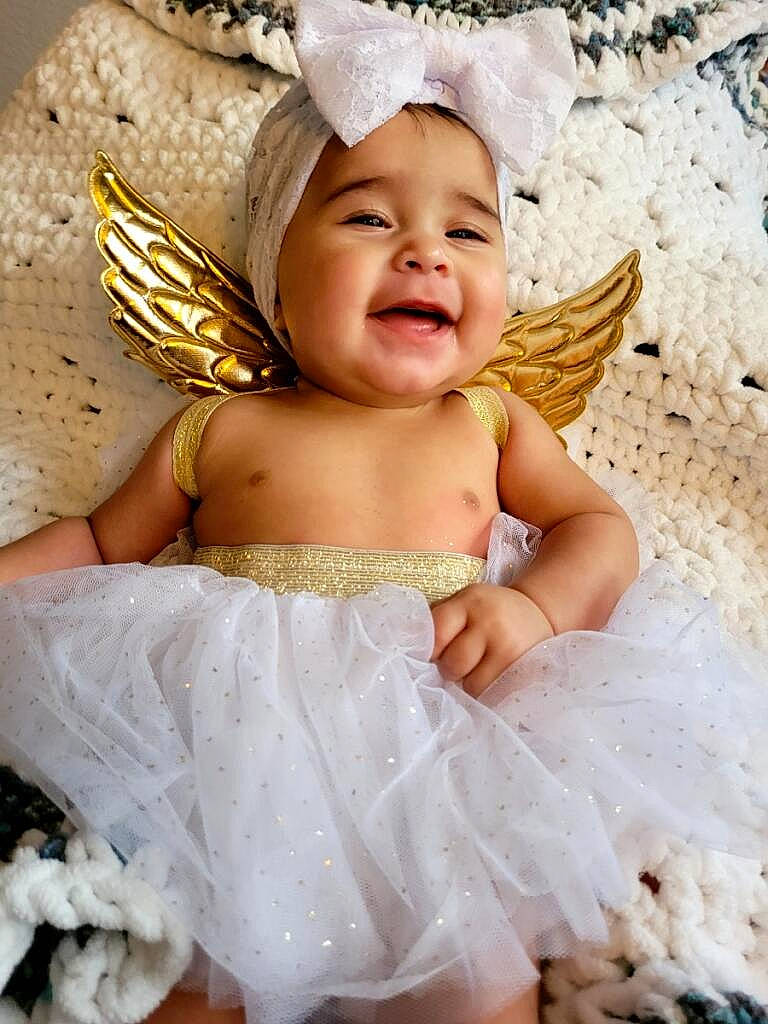 Savannah is registered to the contest to win money with this photo: baby, baby_toddler_clothing, child, costume_hat, event, fashion_accessory, fun, hair_accessory, happy, headband, headgear, headpiece, headwear, mythical_creature, party_supply, pattern, person, pink, skin, smile