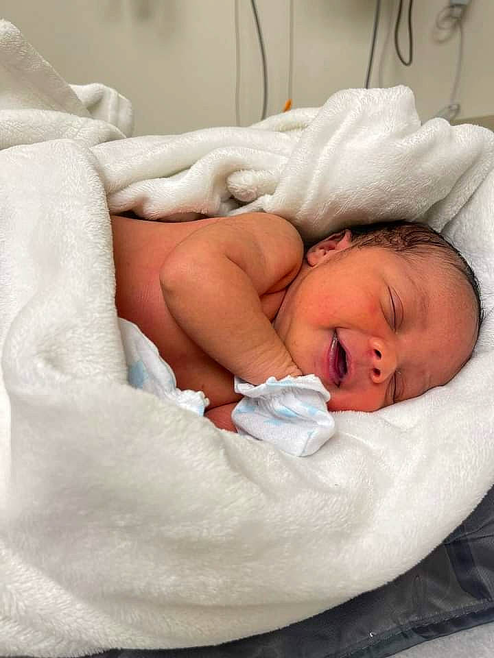 Cassius is registered to the contest to win money with this photo: baby, baby_products, baby_sleeping, baby_toddler_clothing, bedding, bedtime, cheek, child, chin, comfort, eyebrow, headgear, linens, mouth, nap, person, room, skin, sleep, textile