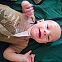 Felix joined the competition — help win amazing prizes! arm, baby, brown_clothing, child, cute, expression, face, green_background, hand, happy, head, indoors, infant, lying_down, motion_blur, person, portrait, skin, smiling, young