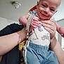 Felix joined the competition — help win amazing prizes! adult, baby, casual, ceiling_light, child, clothing, face, hand, happy, head, holding, indoor, pants, person, playful, portrait, room, shirt, smile, window_blinds