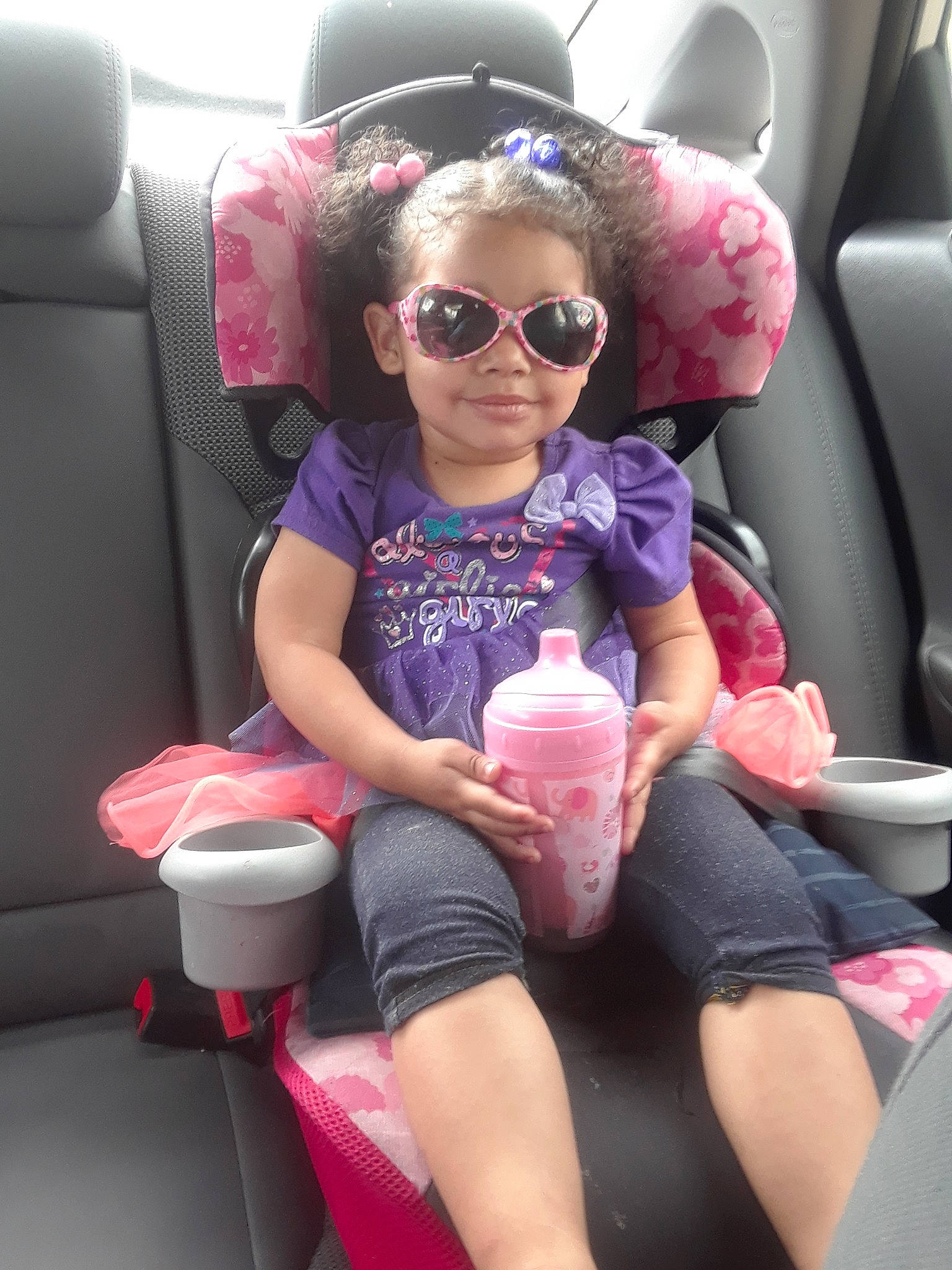Symphanie is registered to the contest to win money with this photo: auto_part, car, car_seat, car_seat_cover, child, cool, daughter, eyewear, family_car, person, pink, seat_belt, sunglasses, toddler, vacation, vehicle, vision_care