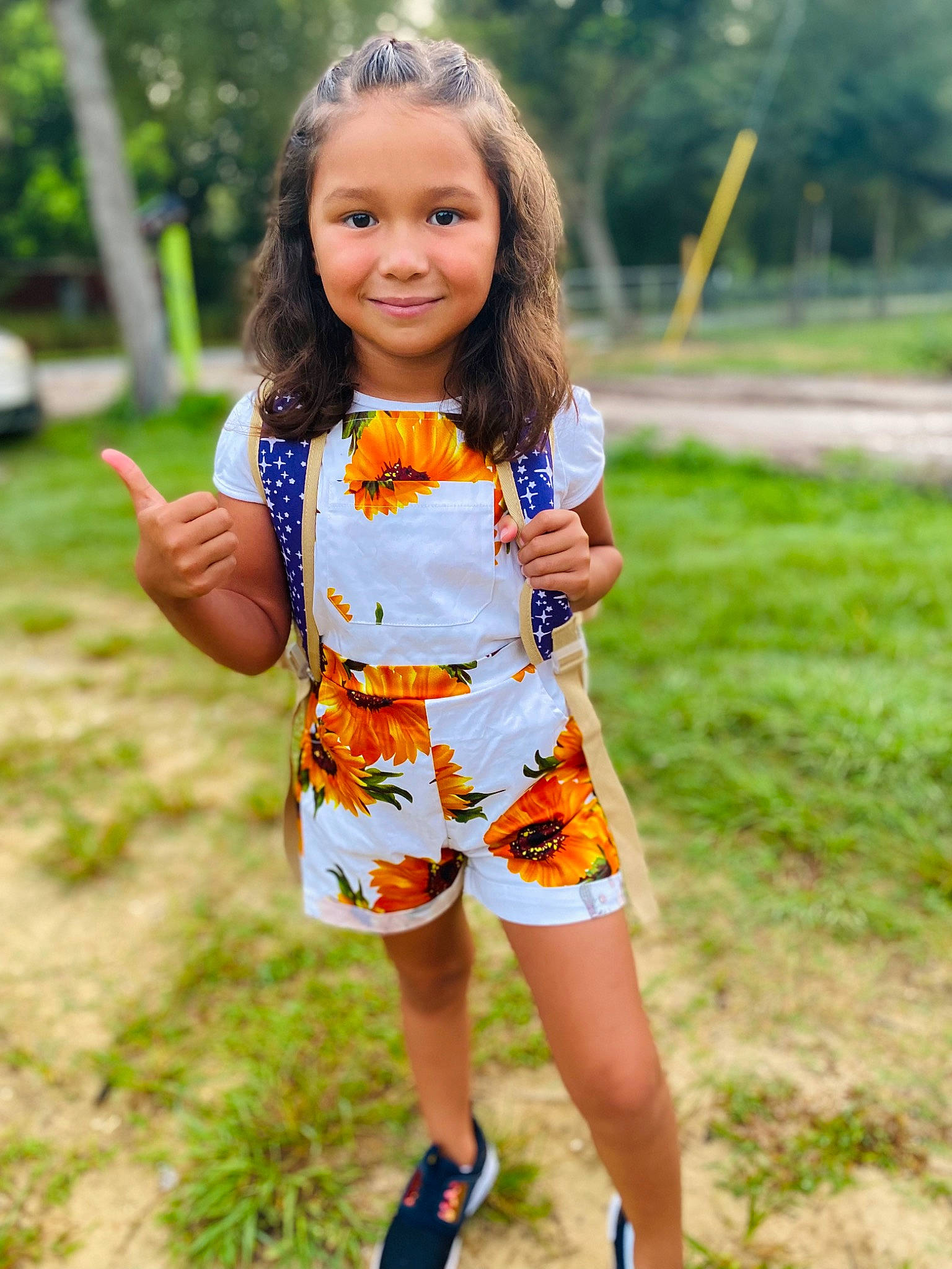 Abigail joined the competition — help win amazing prizes! clothing, dress, eye, grass, hair, happy, joy, leisure, long_hair, orange, people_in_nature, person, plant, recreation, shorts, skin, sleeve, smile, t_shirt, toddler