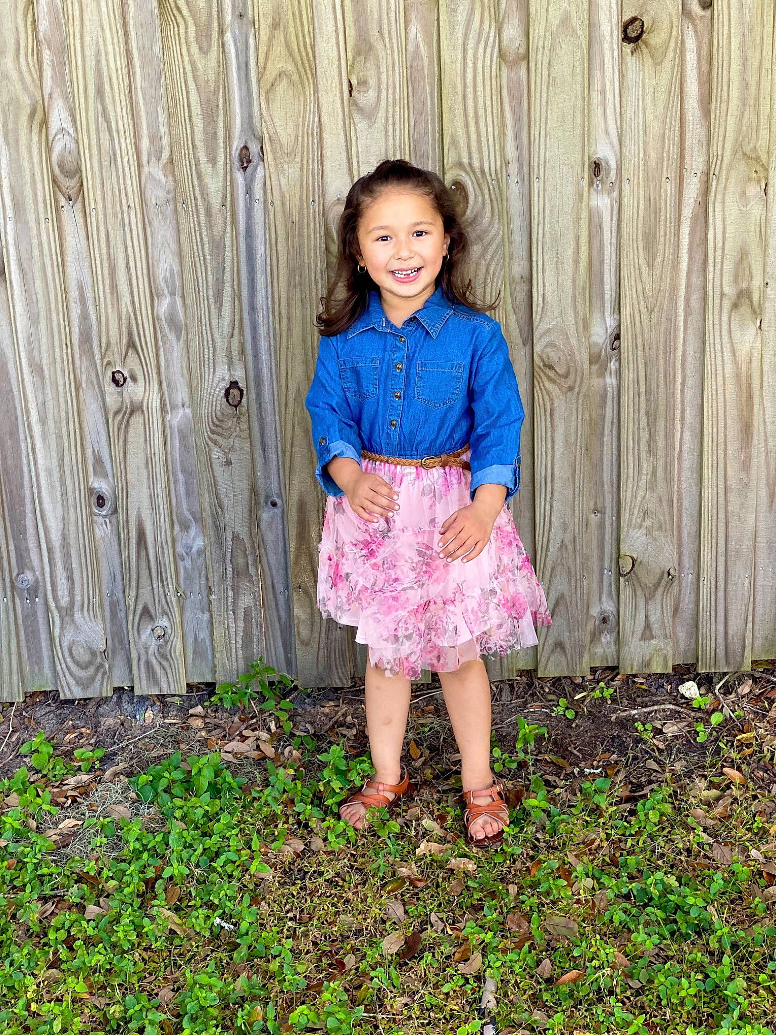 Abigail is registered to the contest to win money with this photo: baby_toddler_clothing, beauty, child, day_dress, eye, grass, grass_family, grassland, happy, human_leg, joy, leg, magenta, people_in_nature, person, pink, plant, skin, smile, toddler