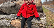 Lou participe au concours pour gagner de l'argent avec cette photo : toddler, child, red_jacket, hat, outdoor, log, wood, moss, nature, fall, winter, path, trees, grass, boots, gloves, cute, portrait, sitting, rural