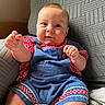 baby, child, infant, romper, clothing, blue, red, checkered, armchair, texture, furniture, indoor, person, cute, smiling, happy, skin, face, hands, seated