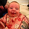 baby, smile, happy, infant, tattoo, hand, clothing, pink, flower, pattern, person, portrait, indoor, couch, holding, cute, face, child, warm, cozy
