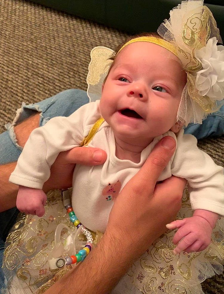 Isabella-rose is registered to the contest to win money with this photo: cheek, child, day, ear, finger, fun, girl, hair_accessory, happiness, head, headgear, human_hair_color, infant, laughter, mouth, nose, person, product, skin, smile