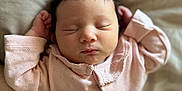 Anaya is registered to the contest to win money with this photo: newborn, baby, sleeping, pink_clothing, blanket, infant, hand, soft_texture, cozy, portrait, peaceful, cute, human, child, indoors, resting, face, small_hands, gentle, toddler