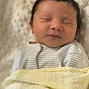 Anaya joined the competition — help win amazing prizes! baby, newborn, sleeping, blanket, clothing, striped, face, infant, soft, cozy, peaceful, portrait, closeup, wrapped, cute, child, resting, head, skin, indoors