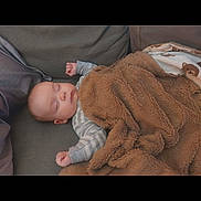 Coyote joined the competition — help win amazing prizes! baby, sleeping, blanket, couch, infant, peaceful, cozy, face, child, indoor, resting, soft, comfort, toddler, clothing, furniture, nap, home, cute, relaxation