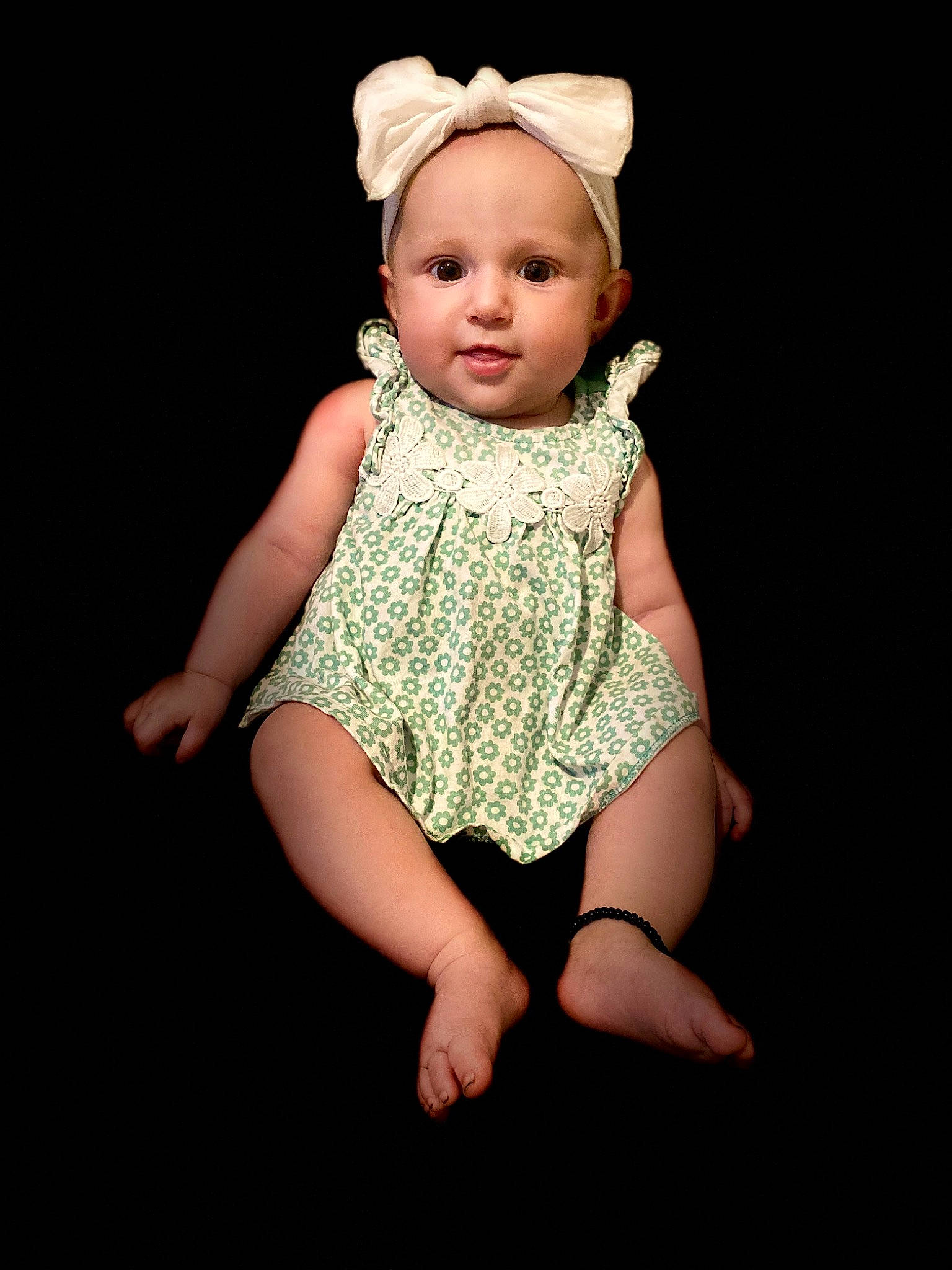 Leona is registered to the contest to win money with this photo: baby, baby_toddler_clothing, cheek, chin, day_dress, dress, embellishment, eye, face, flash_photography, happy, headband, headpiece, human_leg, iris, person, pink, skin, sleeve, thigh