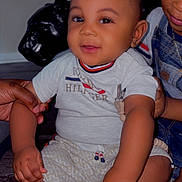 Toriyan joined the competition — help win amazing prizes! toddler, child, baby, smiling, sitting, clothing, shoes, hand, face, person, indoor, family, casual, denim, overalls, floor, toy, holding, cute, happy