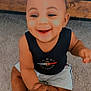 Toriyan joined the competition — help win amazing prizes! baby, child, smiling, sitting, carpet, hand, holding, tank_top, shorts, indoors, dimples, happy, person, footwearless, bed_frame, wood, fabric, cute, skin, young