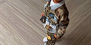 Tyron joined the competition — help win amazing prizes! camouflage, casual_clothing, child, denim_jacket, door, expression, fashion, floor, flooring, hair, home, indoor, pants, person, portrait, socks, standing, toddler, wall, young_child