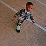 Tyron joined the competition — help win amazing prizes! toddler, child, denim_jacket, denim_pants, colorful_clothing, parking_lot, concrete, walking, outdoor, fashion, patches, black_shoes, cute, young_child, short_hair, confident, casual_wear, urban, daytime, person