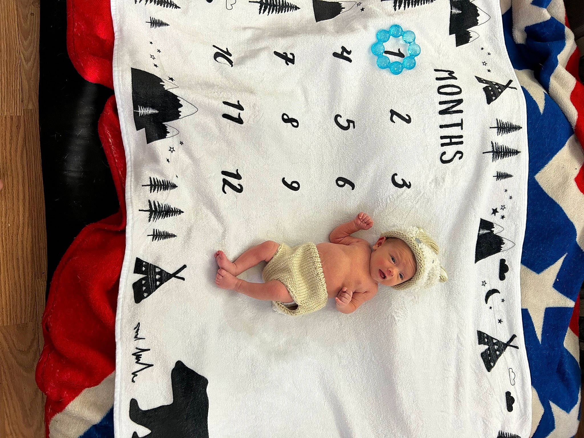 Philip is registered to the contest to win money with this photo: baby, baby_products, baby_toddler_clothing, bedding, child, comfort, facial_expression, font, gesture, happy, linens, pattern, person, rectangle, room, sleeve, t_shirt, throw_pillow, toddler