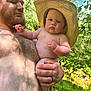 baby, man, hat, drool, shirtless, outdoor, forest, greenery, river, nature, holding, child, sunlight, adult, skin, beard, hand, person, summer, daytime
