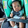 baby, child, car_seat, seat_belt, white_bow, white_shoes, infant, safety, car_interior, cute, portrait, straps, comfort, child_safety, seat, young_child, infant_clothing, car_trip, close_up, serious_expression