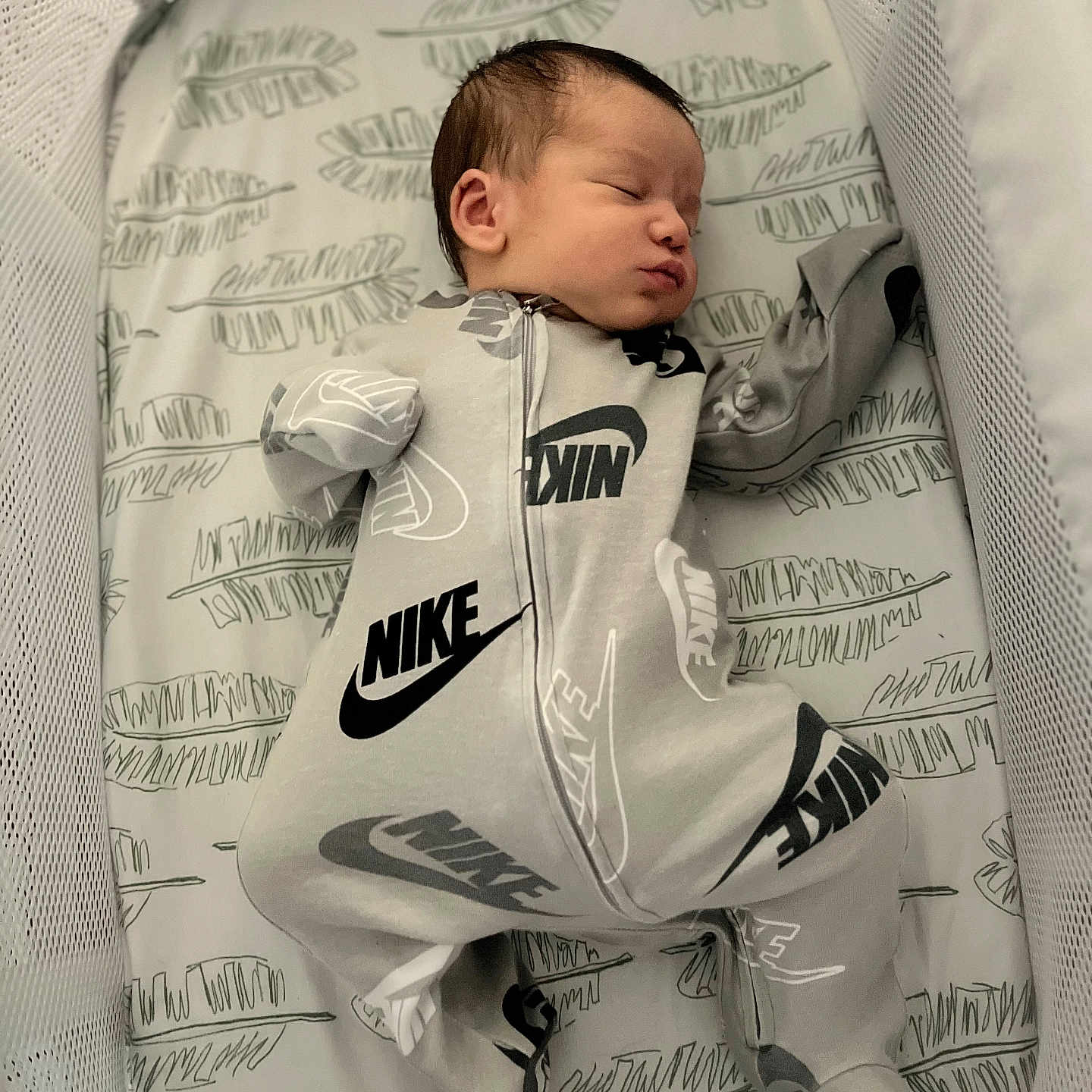 Kyrie is registered to the contest to win money with this photo: baby, bed, blanket, bodypart, clothing, cradle, crib, cushion, face, furniture, head, homedecor, infantbed, knitwear, newborn, person, photography, portrait, sleeping, sweater