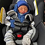 baby, blue_jacket, bundle, car_seat, child, closeup, cozy, cute, hat, indoor, infant, knitted_mittens, newborn, peaceful, portrait, safety_harness, seat_belt, sleeping, striped_clothing, transportation
