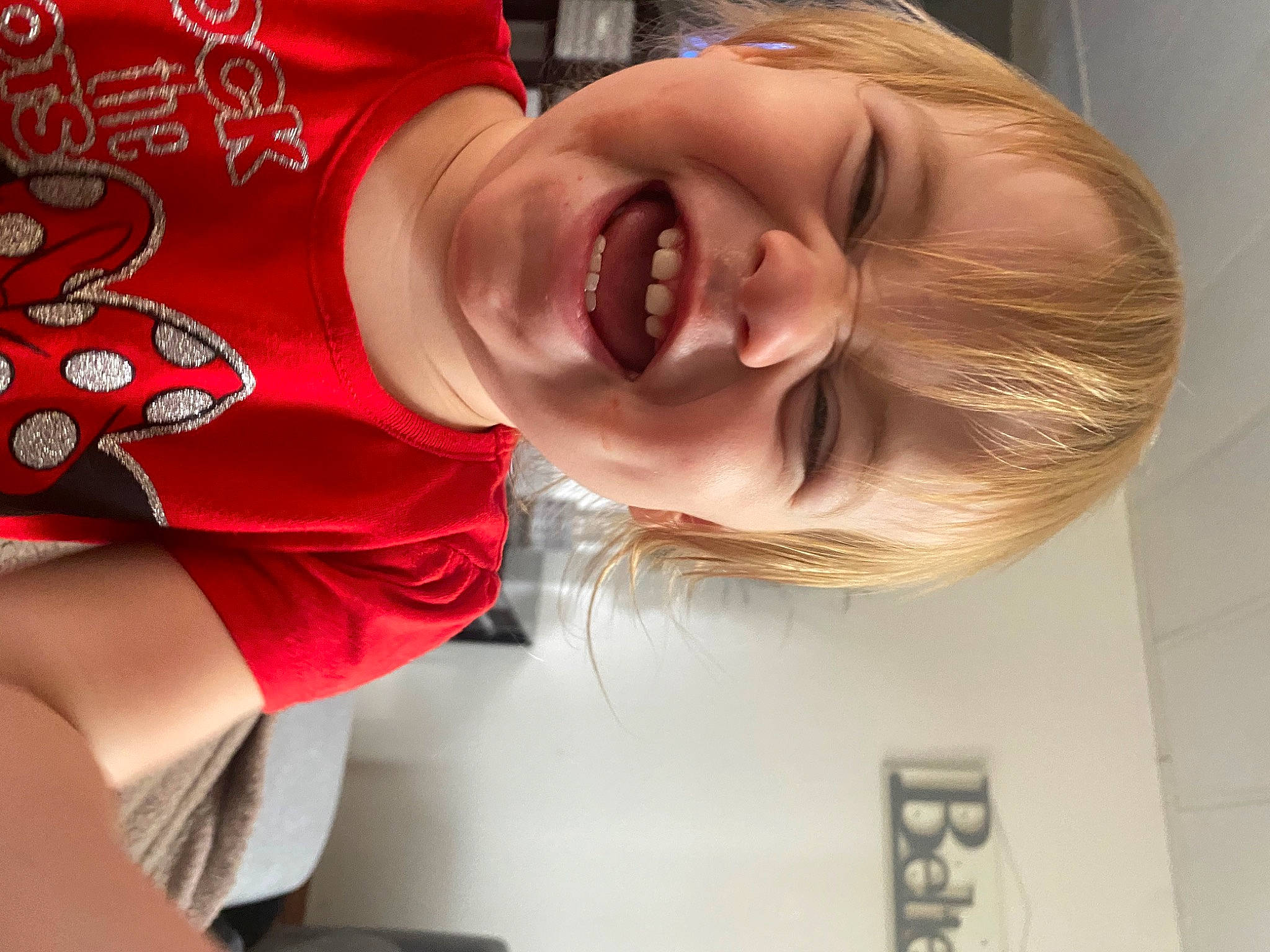 Noel is registered to the contest to win money with this photo: arm, child, chin, ear, facial_expression, forehead, hair_coloring, happy, joy, laugh, mouth, muscle, neck, nose, person, red, smile