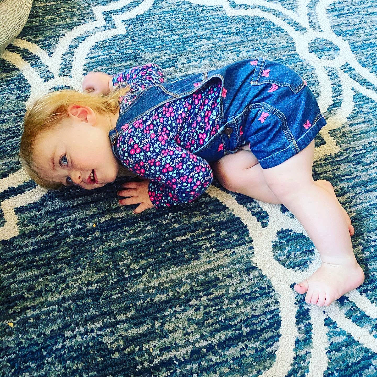 Noel is registered to the contest to win money with this photo: baby, beauty, blond, blue, child, design, dress, floor, flooring, grass, human_leg, joint, leg, long_hair, nap, pattern, person, plant, skin, thigh
