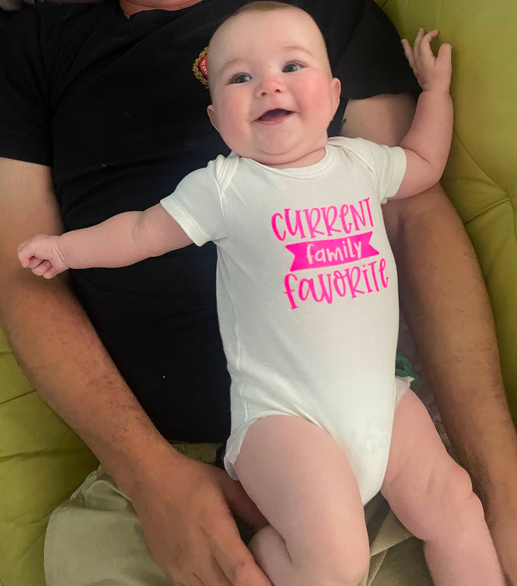 Evie is registered to the contest to win money with this photo: baby, baby_toddler_clothing, cheek, cool, eye, face, finger, gesture, happy, head, joint, joy, neck, organ, person, pink, skin, sleeve, smile, stomach