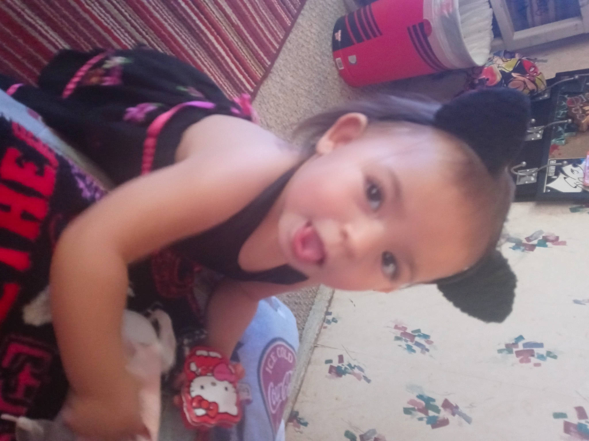 Gabryella is registered to the contest to win money with this photo: buzz_cut, cheek, child, chin, ear, elbow, flooring, fun, happy, magenta, mouth, nose, pattern, person, room, sitting, skin, smile, toddler