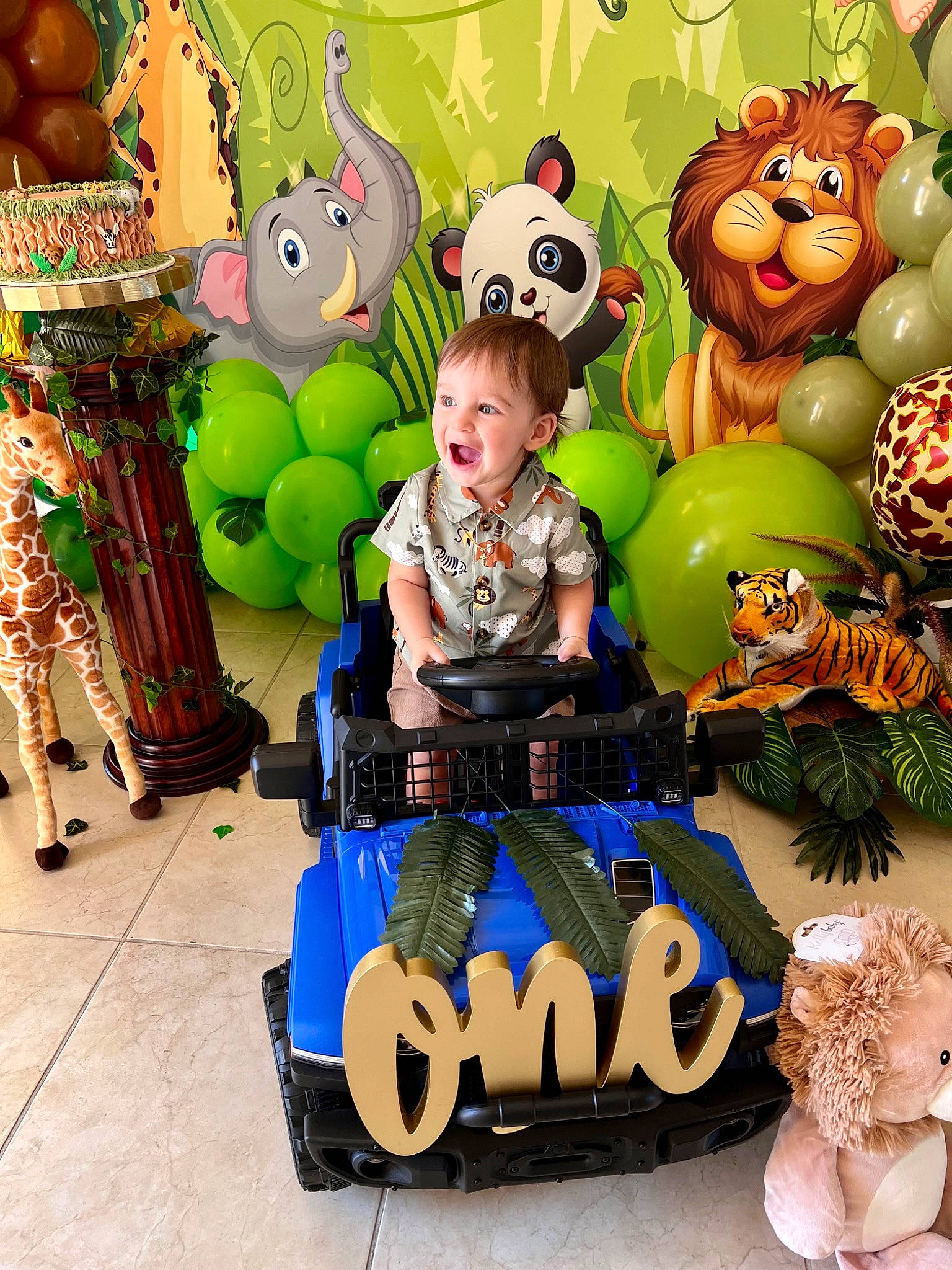 Ian is registered to the contest to win money with this photo: animation, art, baby_products, baby_toys, child, event, fictional_character, font, fun, happy, mammal, person, riding_toy, room, stuffed_toy, tire, toddler, toy, toy_vehicle, vertebrate