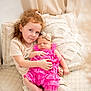 child, baby, girl, infant, sibling, couch, pillow, pink_dress, headband, indoor, portrait, love, family, cute, sleeping, holding, cozy, homedecor, soft_lighting, smiling