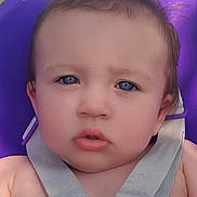 Raven Grace is registered to the contest to win money with this photo: baby, child, infant, portrait, face, eyes, blue_eyes, brown_hair, sitting, swing, purple, safety_harness, harness, outdoor, close_up, looking_at_camera, curious, serious, photography, safe