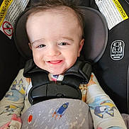 Dorian joined the competition — help win amazing prizes! baby, car_seat, blanket, space_theme, rocket, planets, smiling, child, happy, infant, clothing, seatbelt, headrest, indoors, cute, portrait, toddler, safety, babywear, playful