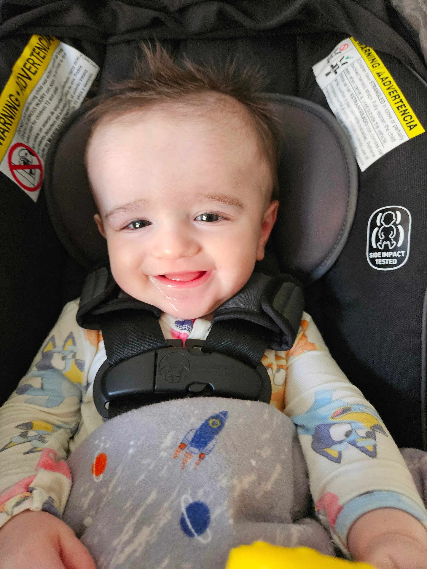 Dorian joined the competition — help win amazing prizes! baby, car_seat, blanket, space_theme, rocket, planets, smiling, child, happy, infant, clothing, seatbelt, headrest, indoors, cute, portrait, toddler, safety, babywear, playful
