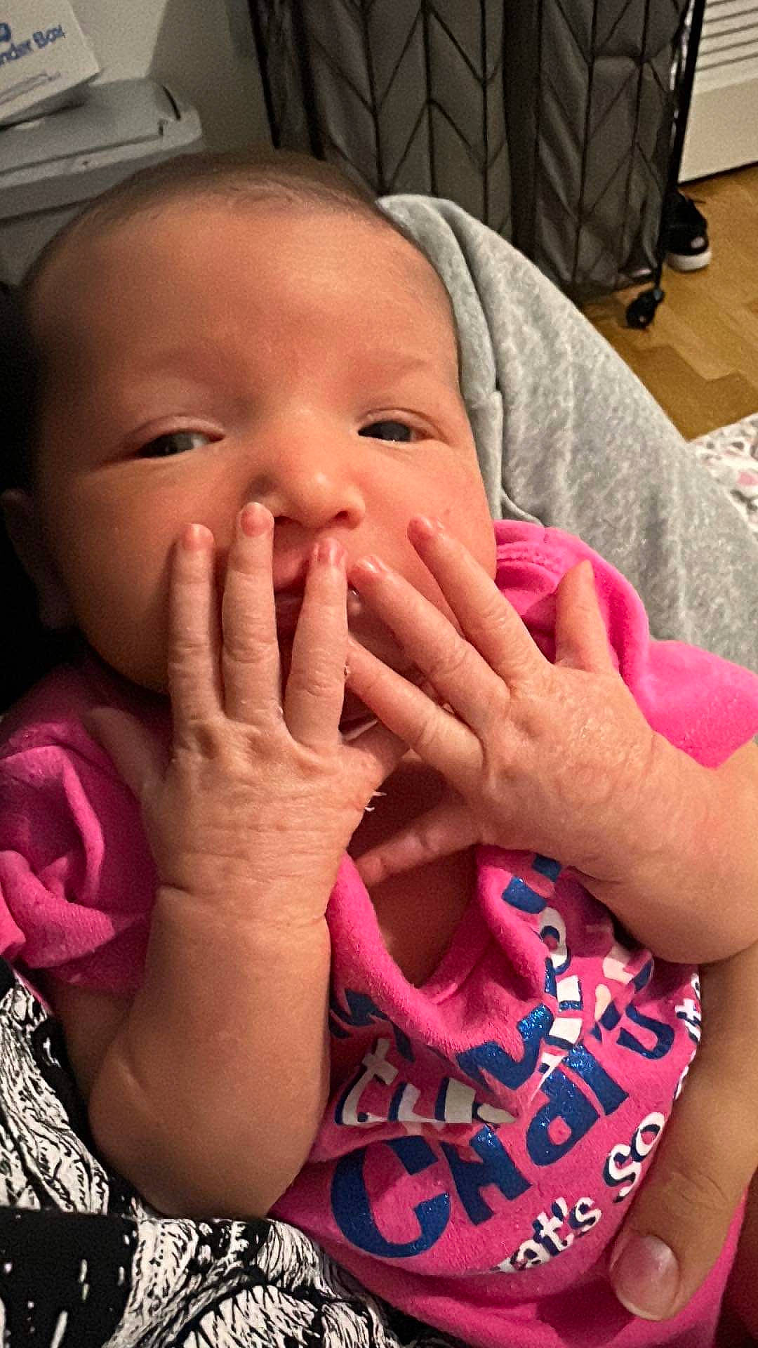 Kaelynn is registered to the contest to win money with this photo: baby, baby_toddler_clothing, cheek, chin, eyebrow, eyelash, finger, gesture, hand, happy, iris, lip, mouth, nail, nose, person, pink, skin, sleeve, smile