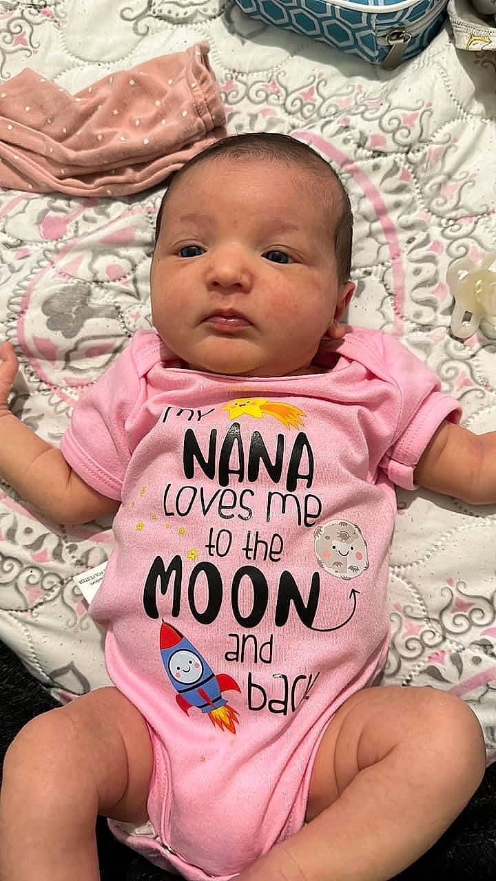 Kaelynn is registered to the contest to win money with this photo: baby, baby_toddler_clothing, cheek, chin, comfort, eye, eyebrow, face, happy, head, lip, mouth, neck, nose, person, pink, product, skin, sleeve, textile