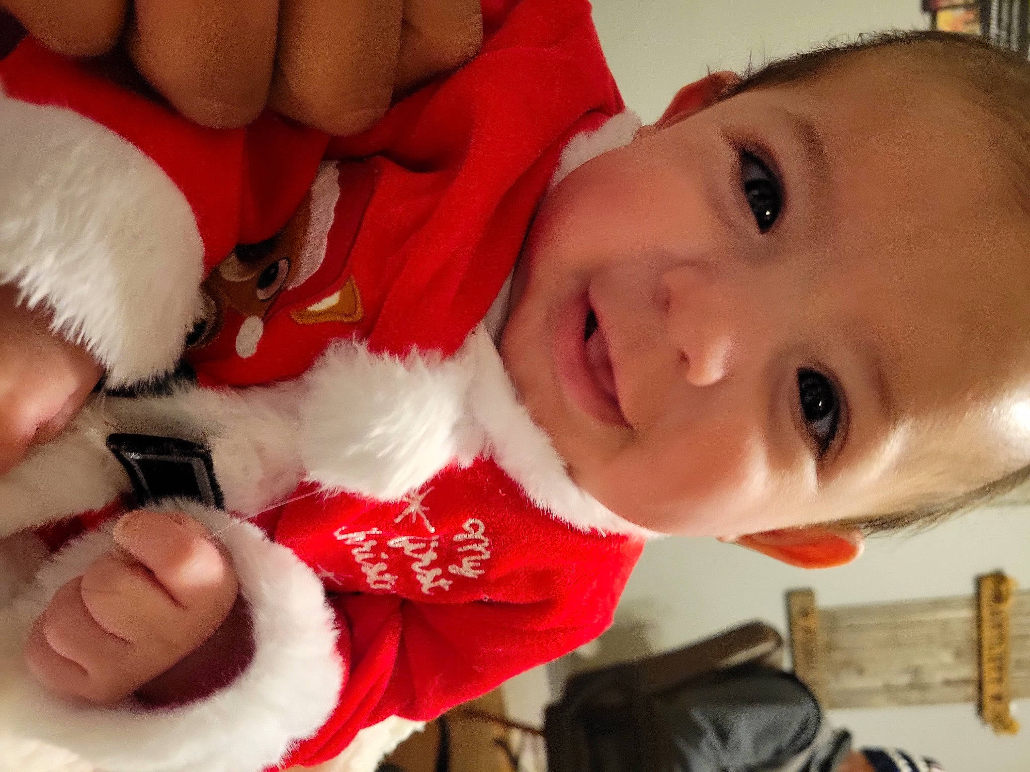 Eleazar joined the competition — help win amazing prizes! baby, cheek, child, christmas, facial_expression, finger, fun, happy, human_body, lap, lip, mouth, nose, person, red, santa_claus, skin, smile, toddler, vertebrate