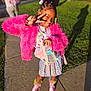 Sky joined the competition — help win amazing prizes! child, girl, pink_jacket, peace_sign, water_bottle, tablet, colorful_shoes, plaid_skirt, outdoor, sidewalk, sunny, grass, braided_hair, hair_accessories, smiling, casual_clothing, urban, daylight, portrait, person