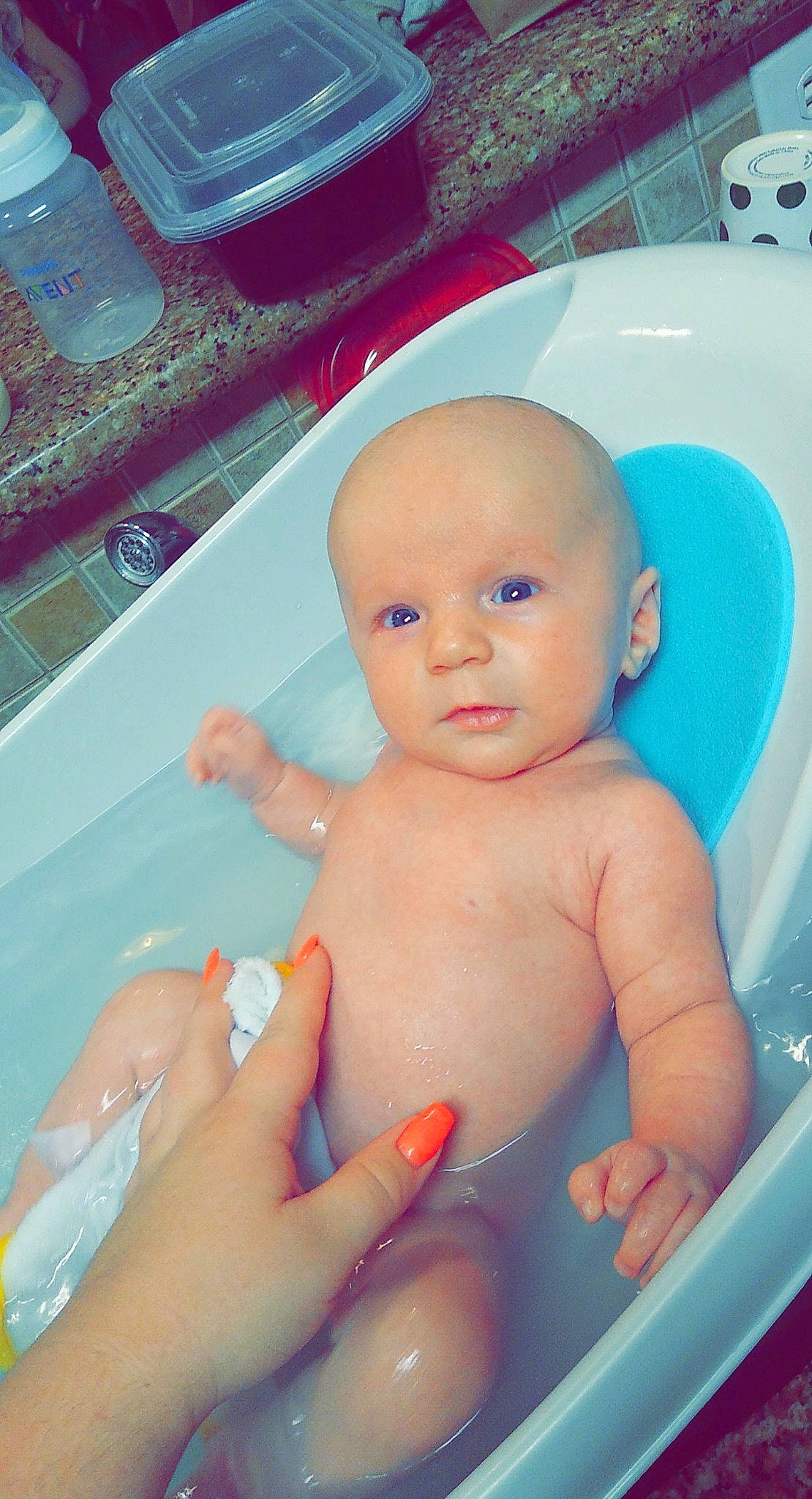 Riley is registered to the contest to win money with this photo: azure, baby, baby_bathing, bathing, bathroom, bathtub, blue, cheek, finger, fluid, fun, hand, leisure, liquid, mouth, person, plumbing_fixture, skin, thumb, toddler
