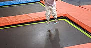 Caylynn joined the competition — help win amazing prizes! child, toddler, baby, trampoline, indoor, playground, jumping, bouncing, portrait, face, person, pink_shirt, patterned_pants, colorful, recreation, family_activity, sports_facility, padded_floor, play_area, happy