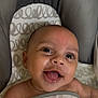 baby, smiling, blanket, infant, happy, face, child, cute, cushion, eyes, mouth, tongue, skin, head, baby_seat, expression, closeup, indoors, joy, comfort