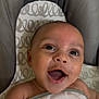 Onzai joined the competition — help win amazing prizes! baby, infant, smiling, blanket, cushion, seat, face, happy, child, skin, expression, mouth_open, eyes, eyelashes, head, person, indoors, closeup, baby_wrap, comfort
