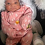 Vanity Marie is registered to the contest to win money with this photo: baby, infant, pink_onesie, headband, blanket, car_seat, baby_bottle, cushion, face, person, newborn, cute, cozy, sleepwear, soft, indoors, resting, adorable, comfort, emoji
