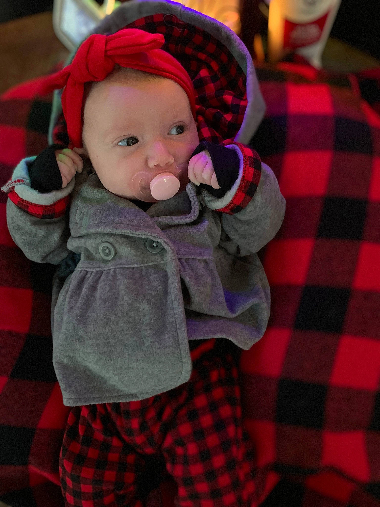 Brynlee joined the competition — help win amazing prizes! baby, baby_toddler_clothing, cheek, child, collar, event, face, fur, green, holiday, lap, pattern, person, plaid, red, sleeve, tartan, textile, toddler, toy