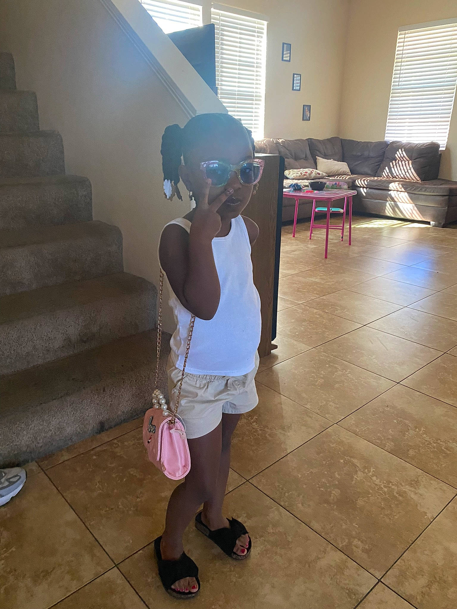 Alaysia joined the competition — help win amazing prizes! cap, child, cool, floor, flooring, foot, fun, happy, hat, human_leg, leisure, luggage_and_bags, person, sandal, sitting, stairs, standing, sun_hat, thigh, toddler