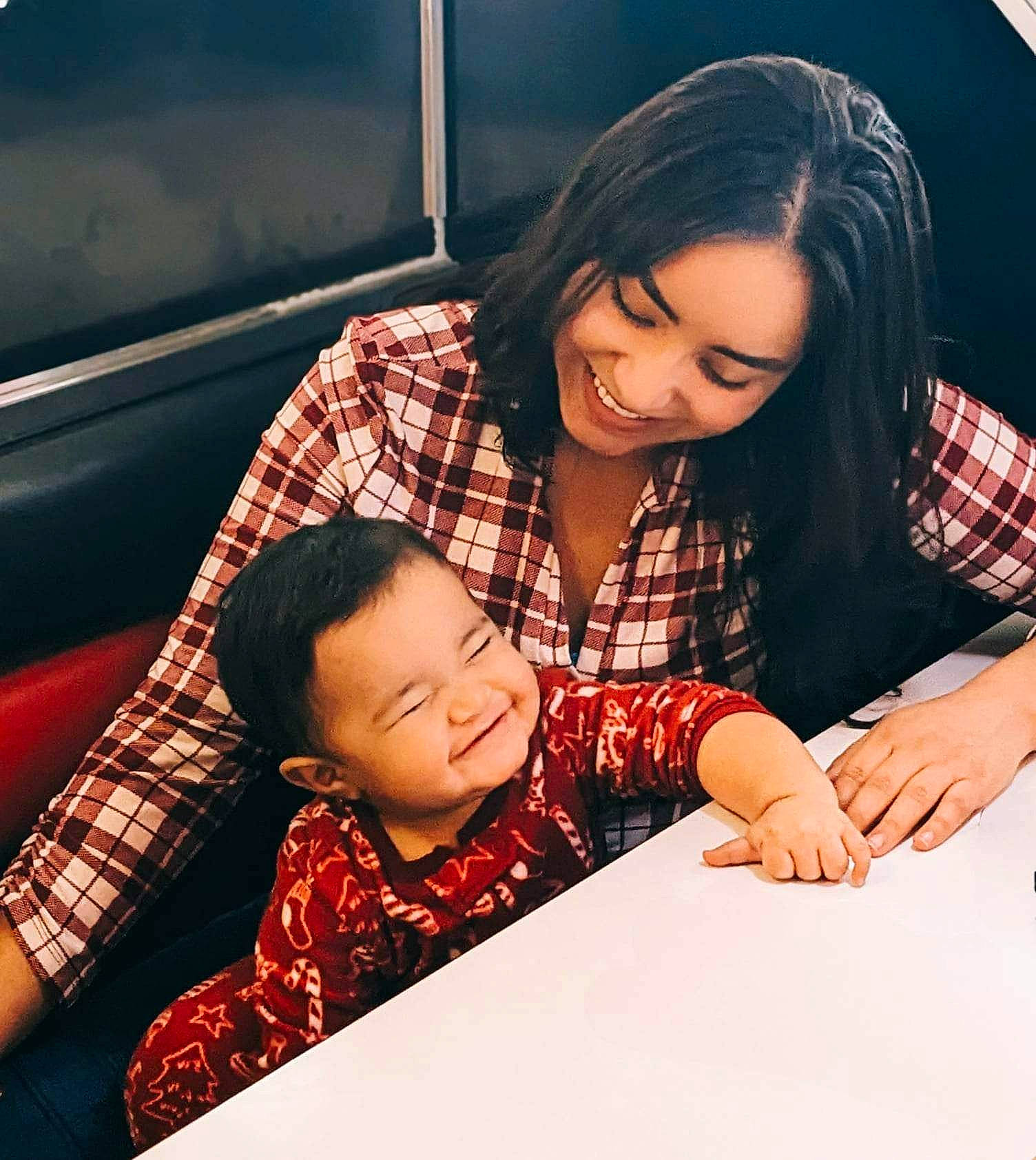 David is registered to the contest to win money with this photo: beauty, black_hair, child, eyelash, facial_expression, flash_photography, friendship, fun, hand, happy, interaction, joy, leisure, mouth, pattern, person, plaid, sitting, smile, table