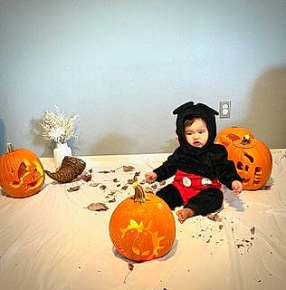 David is registered to the contest to win money with this photo: art, calabaza, cucurbita, flooring, fun, gourd, happy, jack_o_lantern, natural_foods, orange, person, plant, produce, pumpkin, room, squash, still_life_photography, toddler, trick_or_treat, vegetable
