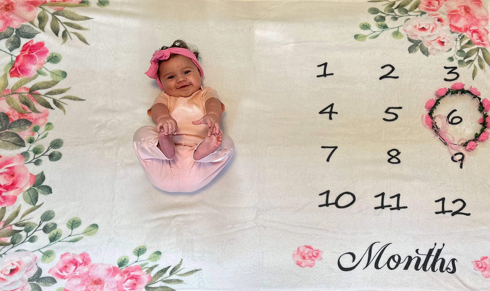 Briella joined the competition — help win amazing prizes! baby, bathing, child, creative_arts, dishware, floral_design, flower_arranging, font, happy, headpiece, headwear, joy, magenta, pattern, person, petal, pink, plant, rectangle, serveware